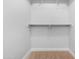 A large walk-in closet featuring carpeted floors and multiple shelving units for storage at 2565 S Signal Butte Rd # 30, Mesa, AZ 85209