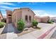 A well-maintained single-story home with tile roof, landscaped front yard, and a two-car garage at 2565 S Signal Butte Rd # 30, Mesa, AZ 85209