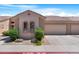 Charming single-story home boasting a two-car garage, tile roof, and desert-friendly landscaping at 2565 S Signal Butte Rd # 30, Mesa, AZ 85209
