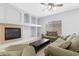 Comfortable living room featuring a fireplace, built-in shelving, and plenty of seating at 2565 S Signal Butte Rd # 30, Mesa, AZ 85209