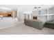 Open concept living area featuring a fireplace, chandelier, and convenient access to the kitchen at 2565 S Signal Butte Rd # 30, Mesa, AZ 85209