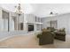Comfortable living space with a fireplace, arched shelving, and plenty of natural light at 2565 S Signal Butte Rd # 30, Mesa, AZ 85209