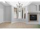 Bright living room with fireplace, tile flooring, and large windows at 2565 S Signal Butte Rd # 30, Mesa, AZ 85209
