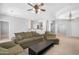 Open concept living room featuring a ceiling fan, a chandelier, and views of the kitchen at 2565 S Signal Butte Rd # 30, Mesa, AZ 85209
