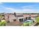 Aerial view of the backyard, showcasing the pool, covered patio, and well-manicured landscaping at 2652 E Pelican Ct, Gilbert, AZ 85297
