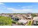 Scenic aerial view of an outdoor living space with a covered patio, pool, and lush greenery at 2652 E Pelican Ct, Gilbert, AZ 85297