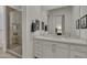 Modern bathroom with a glass-enclosed shower, vanity with quartz countertop, and refined decor at 2652 E Pelican Ct, Gilbert, AZ 85297