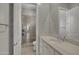 Elegant bathroom featuring a glass-enclosed shower and quartz countertop vanity at 2652 E Pelican Ct, Gilbert, AZ 85297