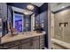 Stylish bathroom with a vanity, framed art, and a modern glass-enclosed shower at 2652 E Pelican Ct, Gilbert, AZ 85297