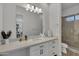 Modern bathroom with a spacious vanity, sleek fixtures, and a glass enclosed shower at 2652 E Pelican Ct, Gilbert, AZ 85297