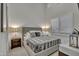 Well-lit bedroom with shuttered windows, stylish lamps, and a comfortable bed at 2652 E Pelican Ct, Gilbert, AZ 85297
