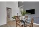 Contemporary dining area features modern table, stylish chairs, and elegant plant decor at 2652 E Pelican Ct, Gilbert, AZ 85297