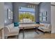Stylish dining area features banquette seating, large window, and serene backyard views at 2652 E Pelican Ct, Gilbert, AZ 85297