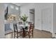 Cozy breakfast nook with glass table, seating for four and abundant sunlight at 2652 E Pelican Ct, Gilbert, AZ 85297