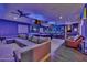 A game room with blue lighting has a sectional couch and a pool table at 2652 E Pelican Ct, Gilbert, AZ 85297