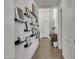 Bright hallway features elegant decor, modern wall shelves, and direct access to main living areas at 2652 E Pelican Ct, Gilbert, AZ 85297