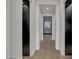 Bright hallway with dark accent wall and hardwood floors at 2652 E Pelican Ct, Gilbert, AZ 85297