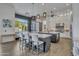 Open-concept kitchen with island seating, flowing seamlessly into living areas with abundant natural light at 2652 E Pelican Ct, Gilbert, AZ 85297
