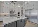 Modern kitchen boasts white cabinetry, a large center island, stainless steel appliances, and ample counter space at 2652 E Pelican Ct, Gilbert, AZ 85297