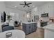 Open-concept kitchen with modern island, stainless appliances, white cabinets, and bright natural light at 2652 E Pelican Ct, Gilbert, AZ 85297