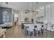 Elegant kitchen with white cabinetry, stainless steel appliances, a center island, and seating for casual dining at 2652 E Pelican Ct, Gilbert, AZ 85297