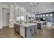 Expansive kitchen boasts double islands, custom cabinetry, and seamless flow to adjacent living spaces at 2652 E Pelican Ct, Gilbert, AZ 85297