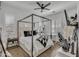 Bright, spacious bedroom featuring a four-poster bed, neutral tones, and lots of natural light at 2652 E Pelican Ct, Gilbert, AZ 85297