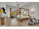 Spacious main bedroom featuring hardwood floors, a ceiling fan, and natural light at 2652 E Pelican Ct, Gilbert, AZ 85297