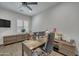 Well-lit office space features a large desk, comfortable chair, and ample storage for a productive workspace at 2652 E Pelican Ct, Gilbert, AZ 85297