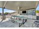 Enjoy outdoor dining in this beautiful outdoor kitchen and dining area with ceiling fan for summer relaxation at 2652 E Pelican Ct, Gilbert, AZ 85297