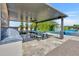 Stylish outdoor dining area featuring a built-in grill, ample counter space, and a dining table perfect for entertaining at 2652 E Pelican Ct, Gilbert, AZ 85297