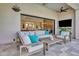 Relaxing outdoor patio with comfortable seating, stylish decor, and seamless transition to the open-concept living space at 2652 E Pelican Ct, Gilbert, AZ 85297