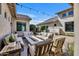 Serene outdoor patio featuring comfortable seating, a fire pit, and views of the landscaped backyard at 2652 E Pelican Ct, Gilbert, AZ 85297