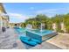 Lush pool area featuring a kayak, water features, and a relaxing spa, perfect for summer days at 2652 E Pelican Ct, Gilbert, AZ 85297