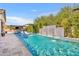 Enjoy this swimming pool with a built in water feature, lounge chairs and a gazebo with a BBQ and outdoor seating at 2652 E Pelican Ct, Gilbert, AZ 85297