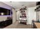 Interesting bedroom with shelves displaying action figures, a sleek black dresser, and three doors for flexibility at 27189 N 75Th Dr, Peoria, AZ 85383