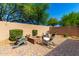 Inviting outdoor fire pit with comfortable seating and paver patio perfect for relaxing evenings at 27189 N 75Th Dr, Peoria, AZ 85383