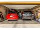 Spacious garage with two cars, ample storage, and organization, perfect for car enthusiasts at 27189 N 75Th Dr, Peoria, AZ 85383