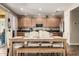 Spacious kitchen and dining area featuring a large island, stainless steel appliances, and a wood dining table at 27189 N 75Th Dr, Peoria, AZ 85383