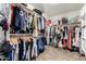 Spacious walk-in closet with ample hanging space and shelving for organized storage of clothing and accessories at 27189 N 75Th Dr, Peoria, AZ 85383