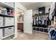 Well-organized walk-in closet with shelves and hanging racks, connecting to a bathroom with double sinks at 27189 N 75Th Dr, Peoria, AZ 85383