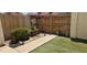 An enclosed backyard featuring a stone path, a small patch of artificial turf, and a potted plant at 2831 E Waltann Ln # 1, Phoenix, AZ 85032
