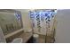 Bathroom featuring a single sink vanity and shower-tub combination at 2831 E Waltann Ln # 1, Phoenix, AZ 85032