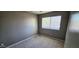 Bedroom featuring neutral tones, a ceiling fan, and natural light at 2831 E Waltann Ln # 1, Phoenix, AZ 85032