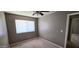 Standard bedroom with window, neutral carpet, and walls ready for personalization at 2831 E Waltann Ln # 1, Phoenix, AZ 85032