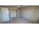 Bedroom featuring an open closet, ample space, and natural lighting at 2831 E Waltann Ln # 1, Phoenix, AZ 85032