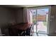 View of the dining area featuring tile floors and a sliding glass door to the exterior of the home at 2831 E Waltann Ln # 1, Phoenix, AZ 85032