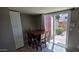 View of the dining area featuring tile floors and a sliding glass door to the exterior of the home at 2831 E Waltann Ln # 1, Phoenix, AZ 85032