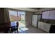 Bright kitchen with tile floors, granite countertops, stainless steel sink, and modern white appliances at 2831 E Waltann Ln # 1, Phoenix, AZ 85032
