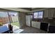 Bright kitchen featuring tile floors, granite countertops, a stainless steel sink, and modern appliances at 2831 E Waltann Ln # 1, Phoenix, AZ 85032